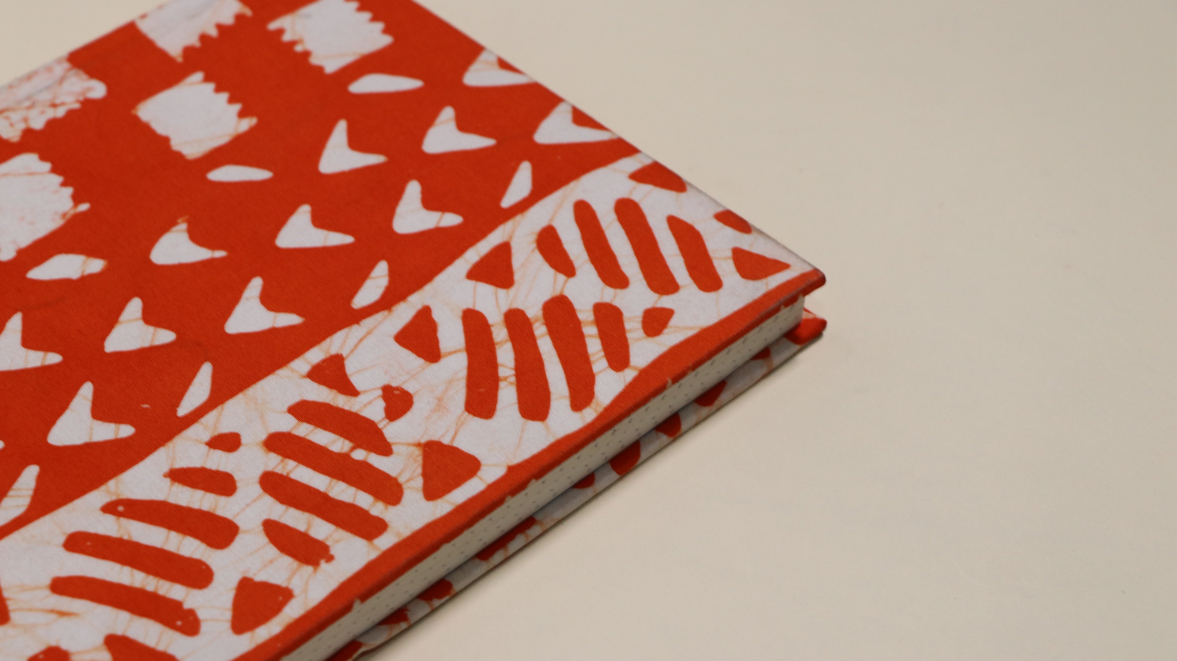 Orange and white printed notebook