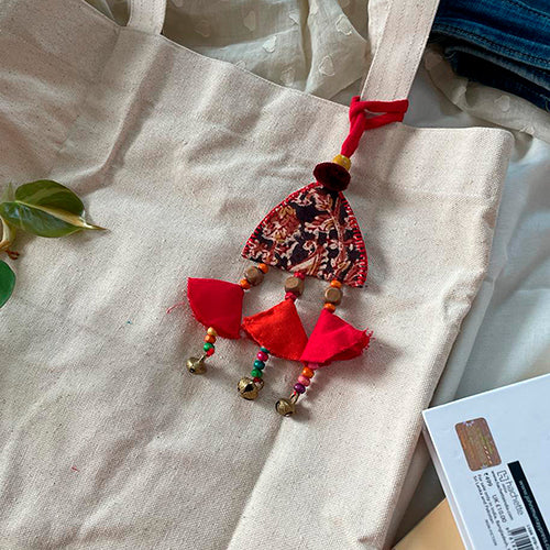 Bell Shaped Bag Accessory with Red Tassels